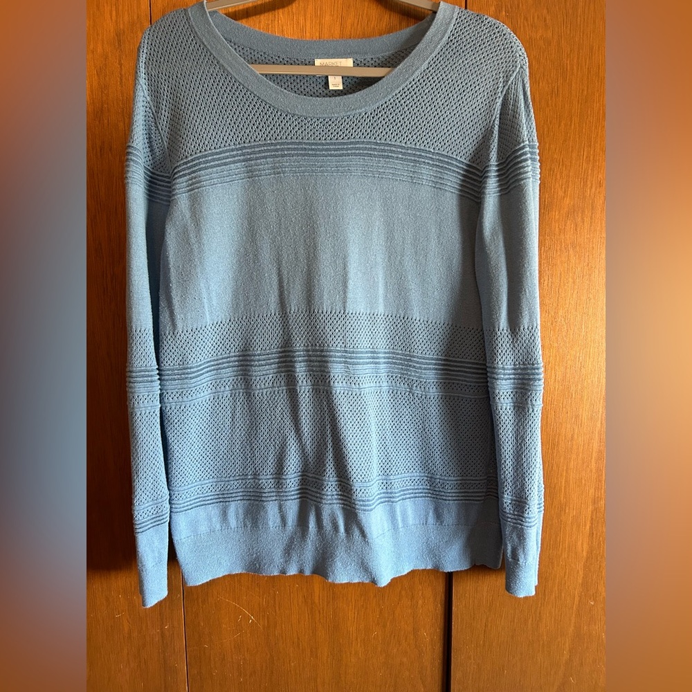 Baby blue sweater with varying stitches